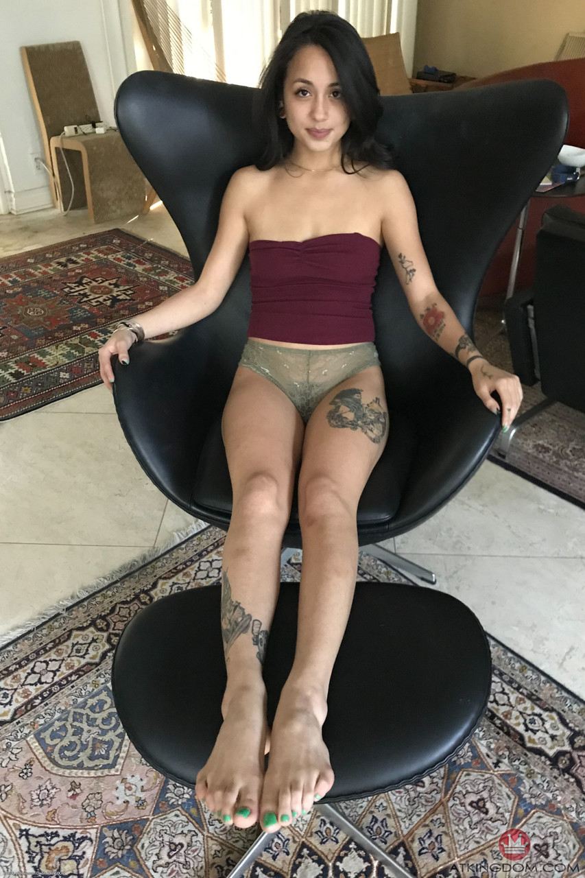 Gorgeous Asian teen Mi Ha Doan unveils her inked body and trimmed pussy  